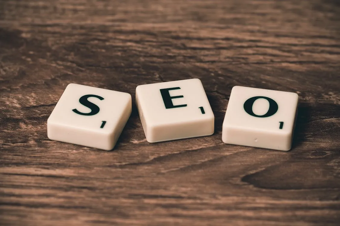 The letters SEO spelled out in Scrabble tiles