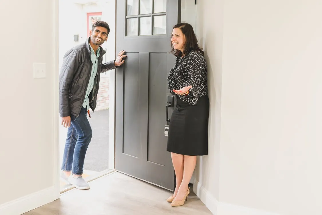 Real estate agent showing the unit to her client