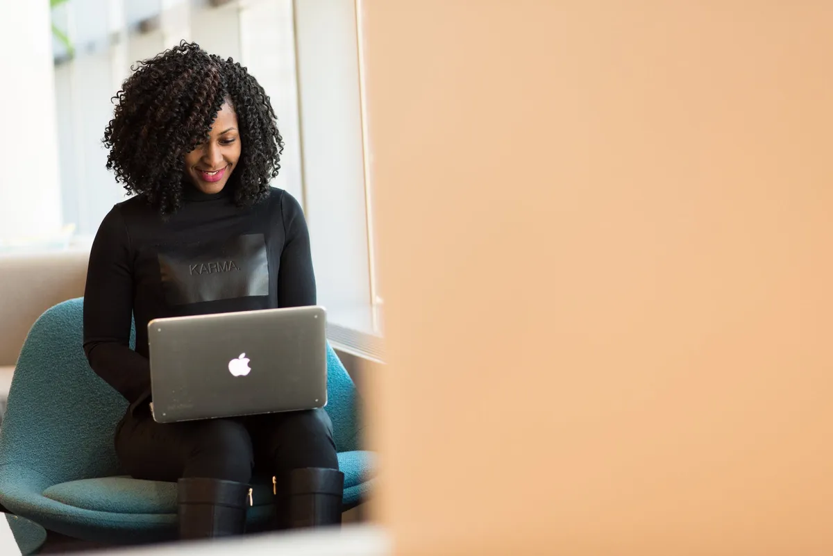 Woman holding macbook