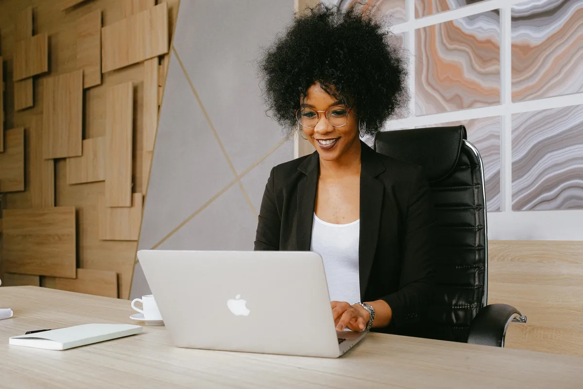 Real estate agent using her computer to generate leads for her real estate business