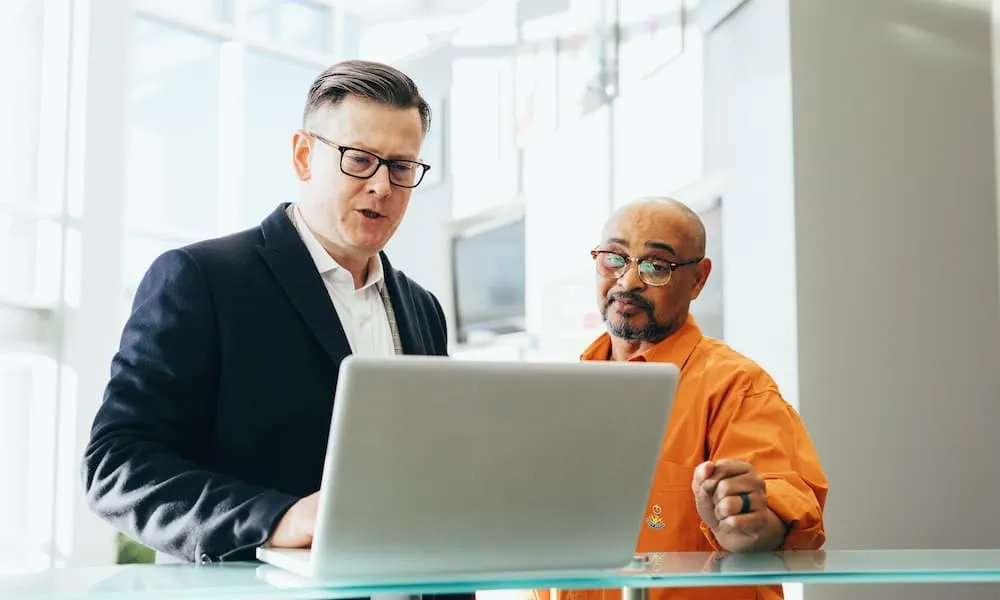 Real estate agent comparing sales figures against ad lead conversions