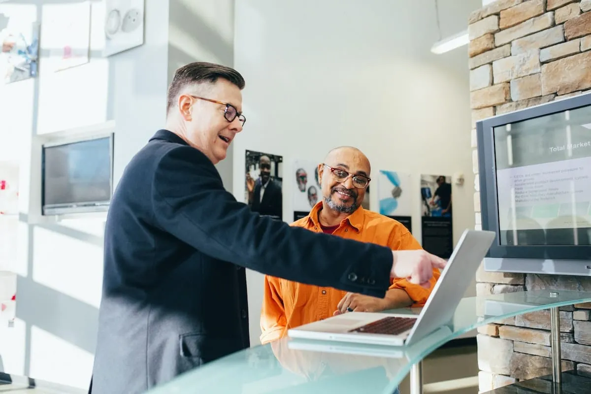 Two people discussing buyer leads through SEO