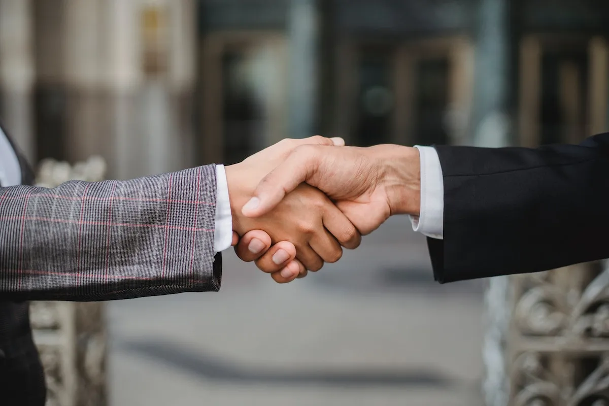 two-people-shaking-hands
