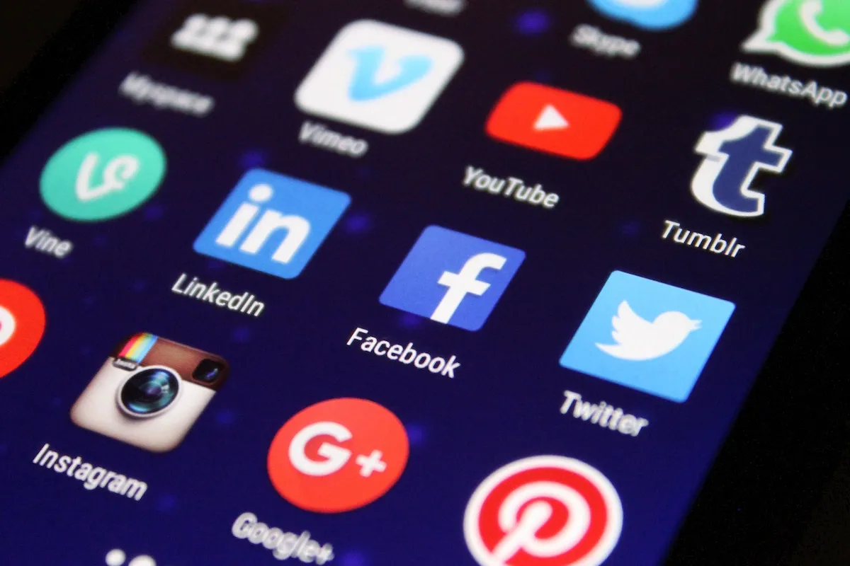 Close-up of a phone screen with social media icons