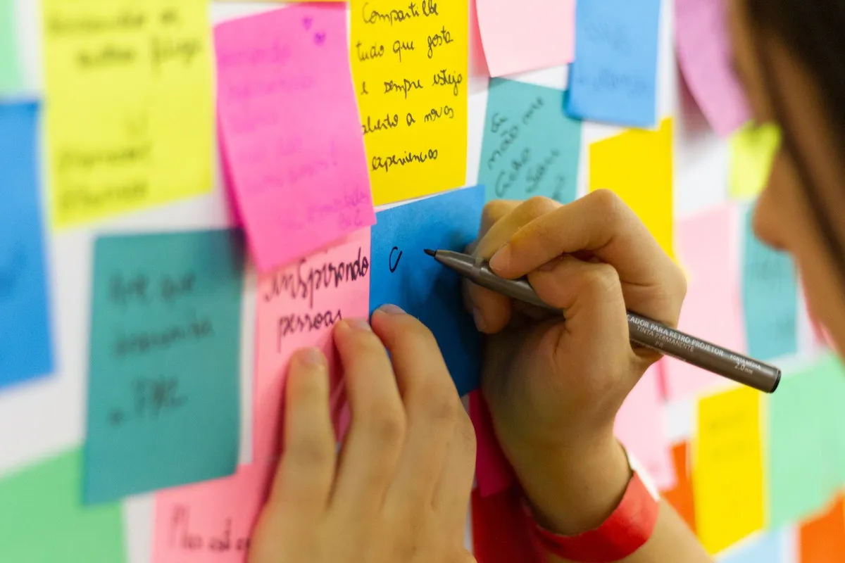 Person writing on notes