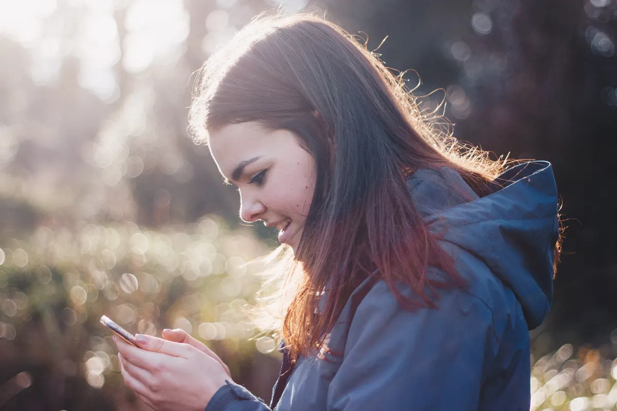 Woman navigating through a mobile-responsive design.
