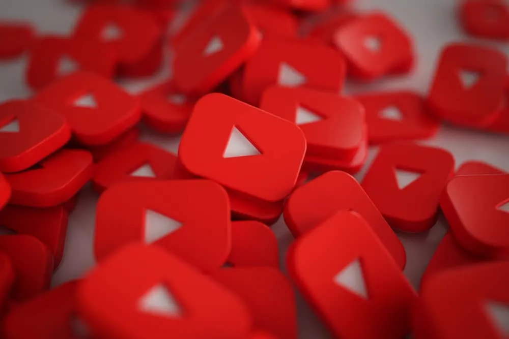 A pile of red YouTube play button icons