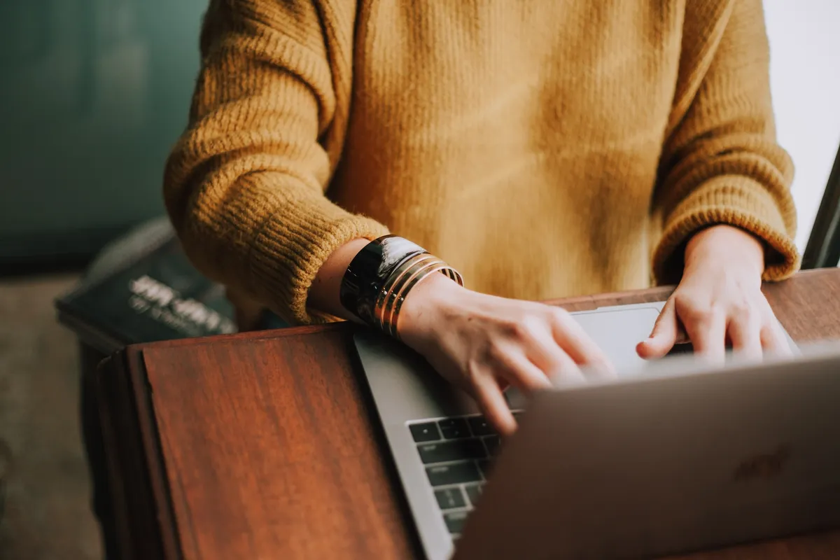Person on the computer watching videos as presented with well-planned marketing strategies.