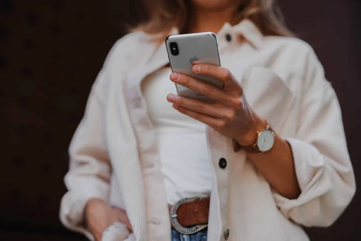 Woman receiving SMS marketing and push notifications for available properties.