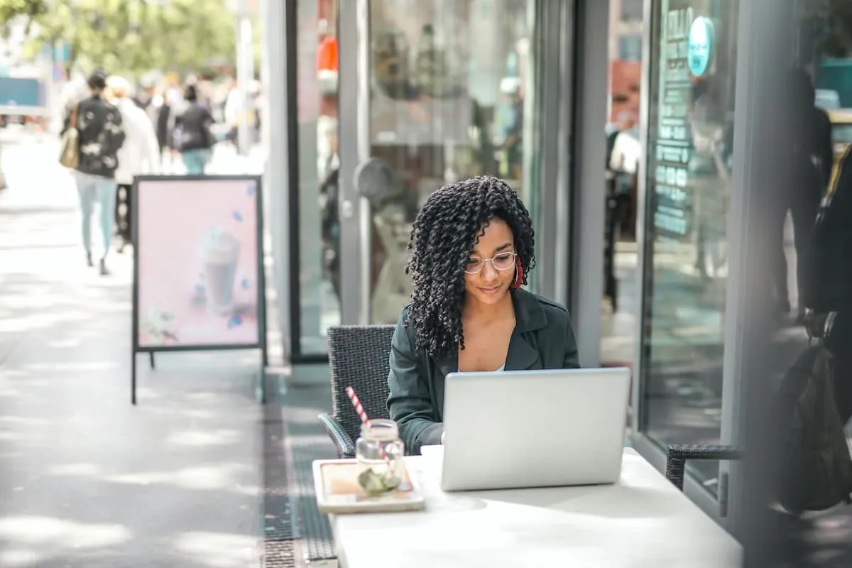 Young woman searching for real estate agents in her area.