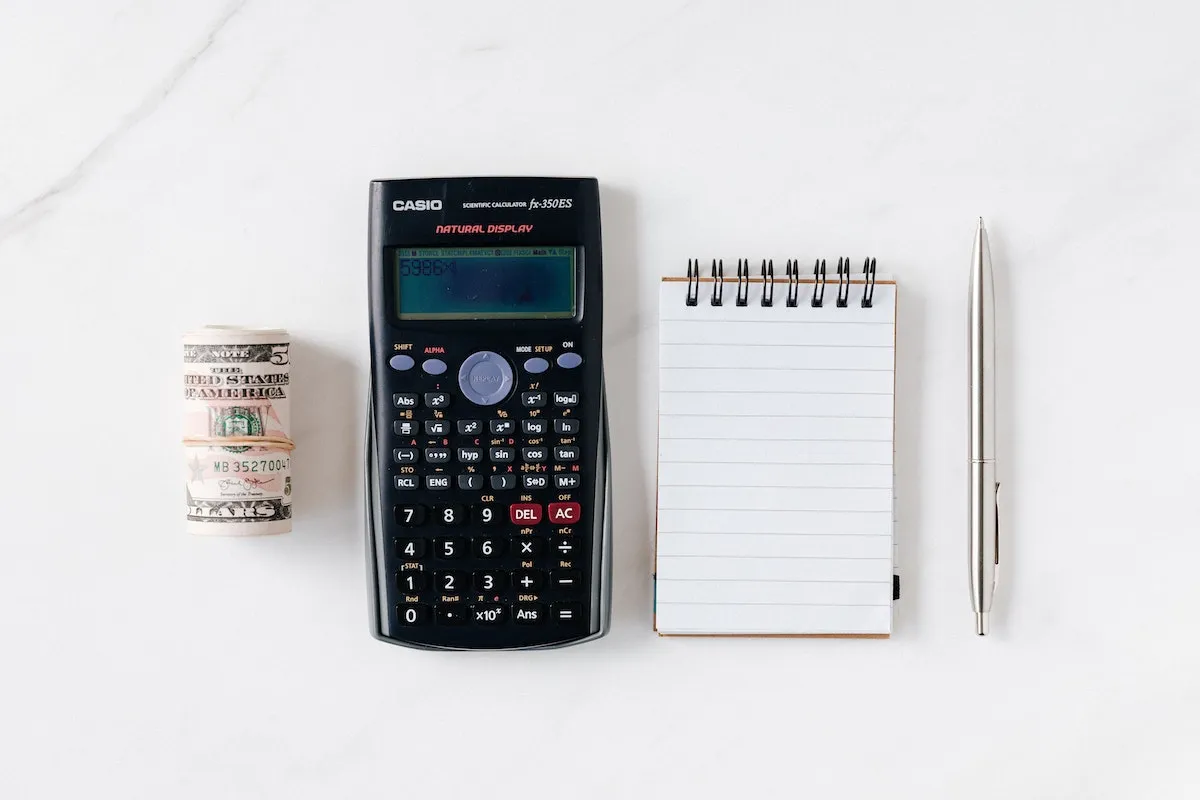 A desk with a budget worksheet, showing how marketing money gets split across channels