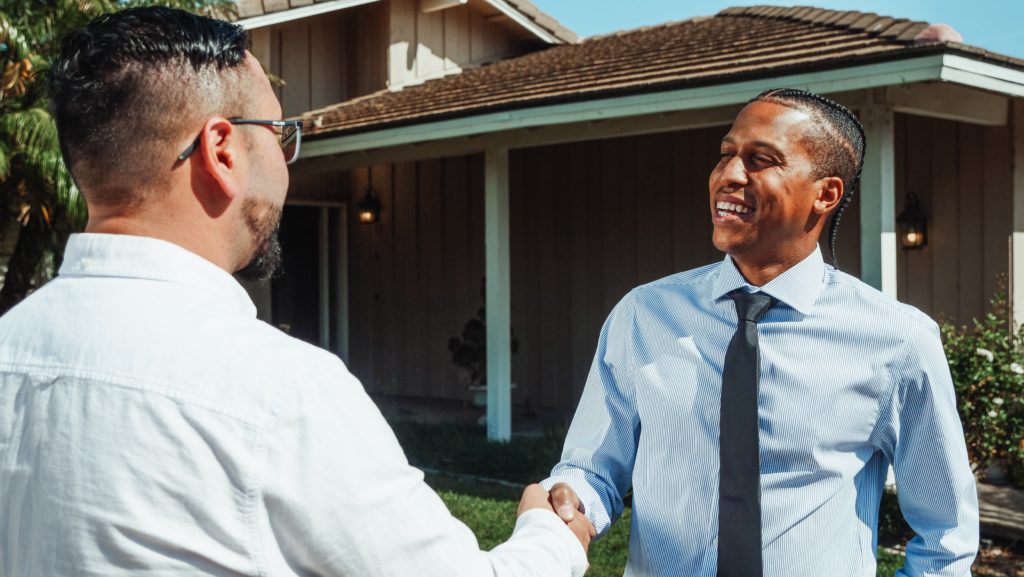 Both men shake hands for agreement