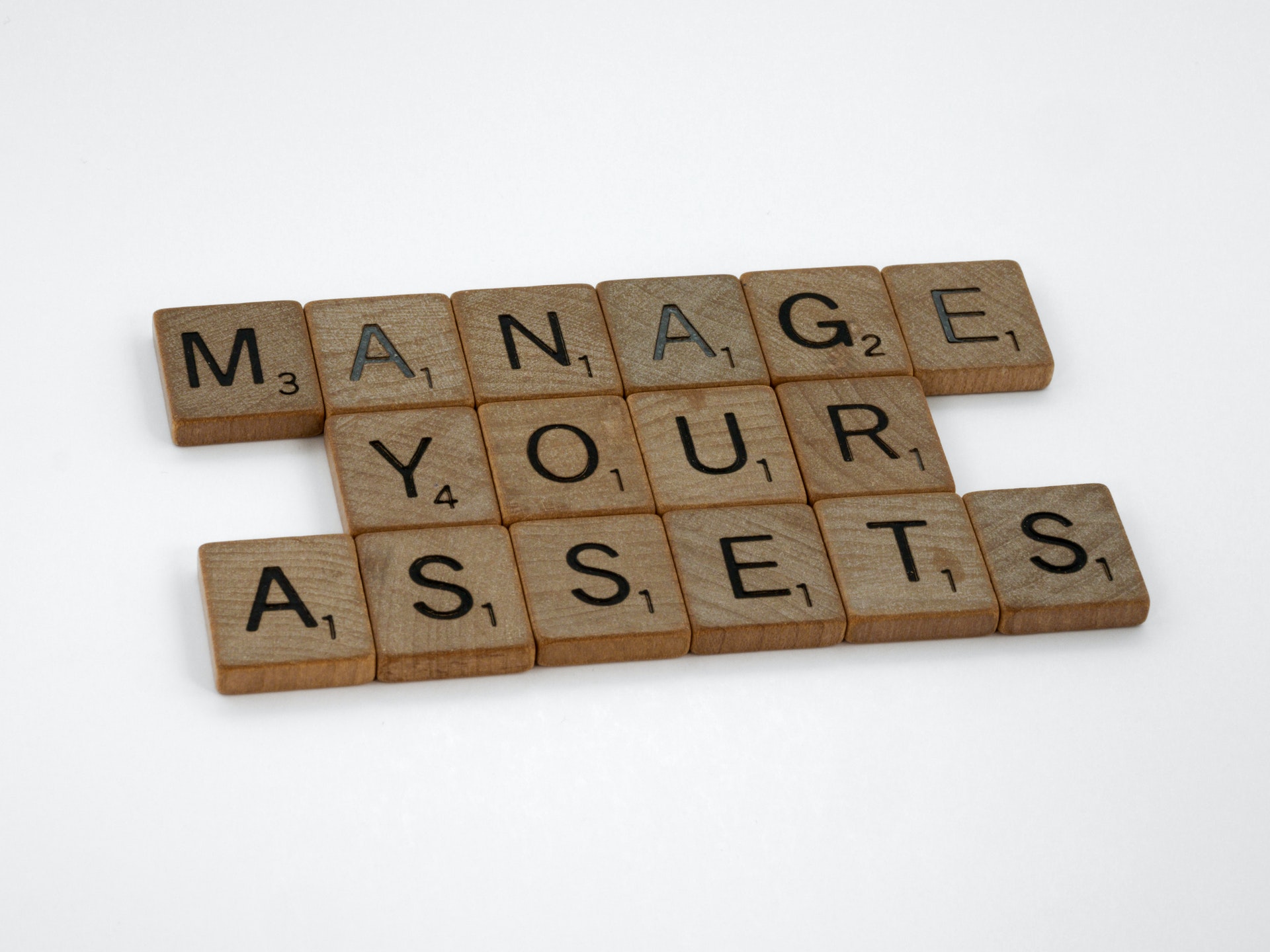 manage your assets written with scrabble letters
