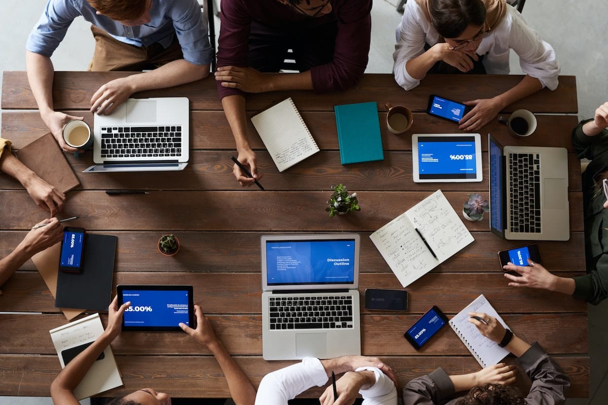 A table with professionals working on lead-buying strategies.