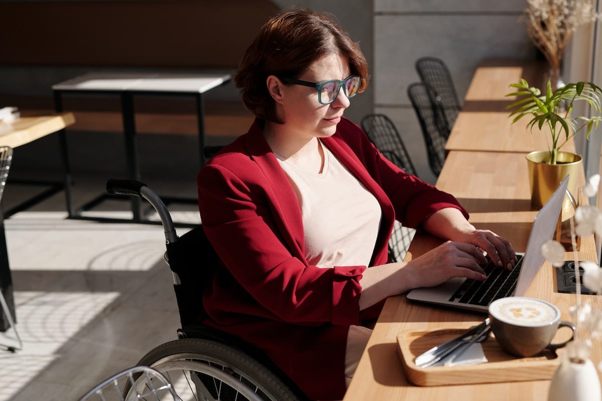 Woman-in-red-blazer-sitting-on-wheelchair