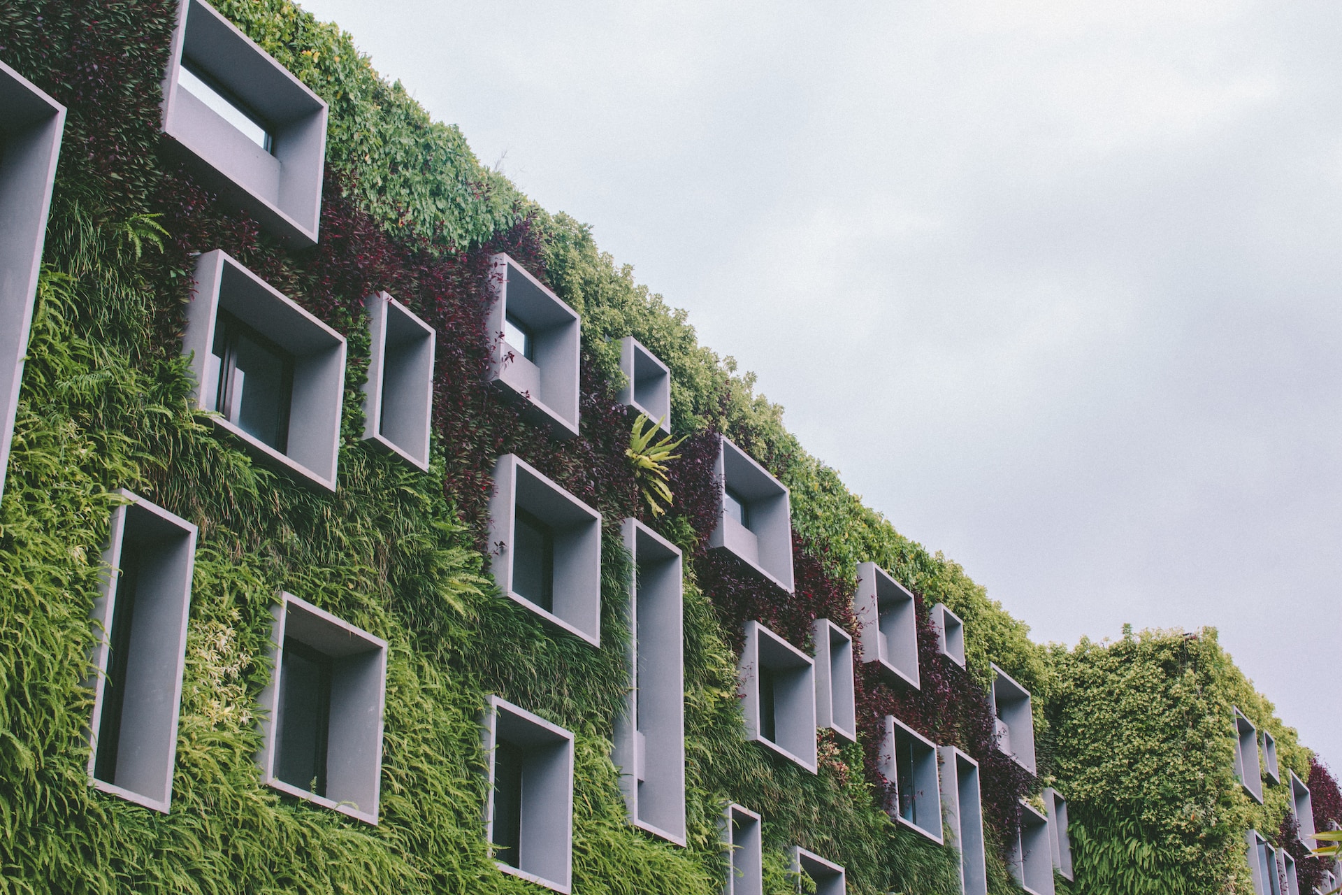Innovative apartment building in Bali, Indonesia, encouraging green efforts.